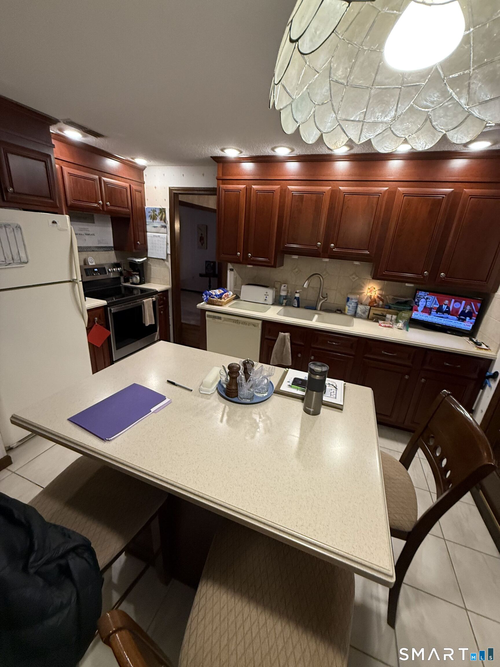 149 High Tower Road Southington, CT 06489 - Photo 12 of 25 a kitchen with a table chairs and a appliances