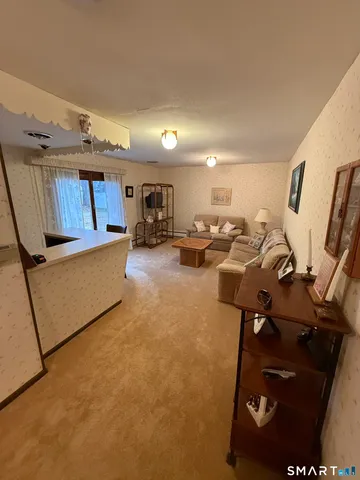 a gym room with furniture and a window