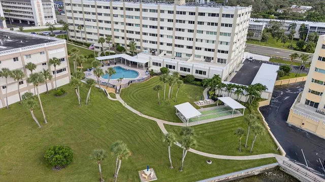 swimming pool view with a garden space