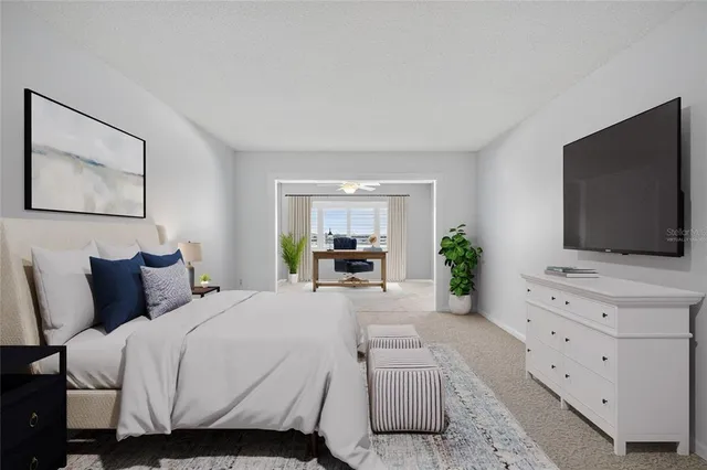 a bedroom with a bed and flat screen tv