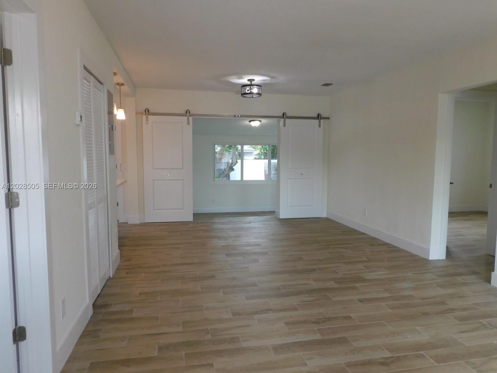 3333 Southwest 89th Avenue Miami, FL 33165 - Photo 5 of 44 Entry way view to living room and dining room. All neutral colors throughout, tiled floors for easy care.