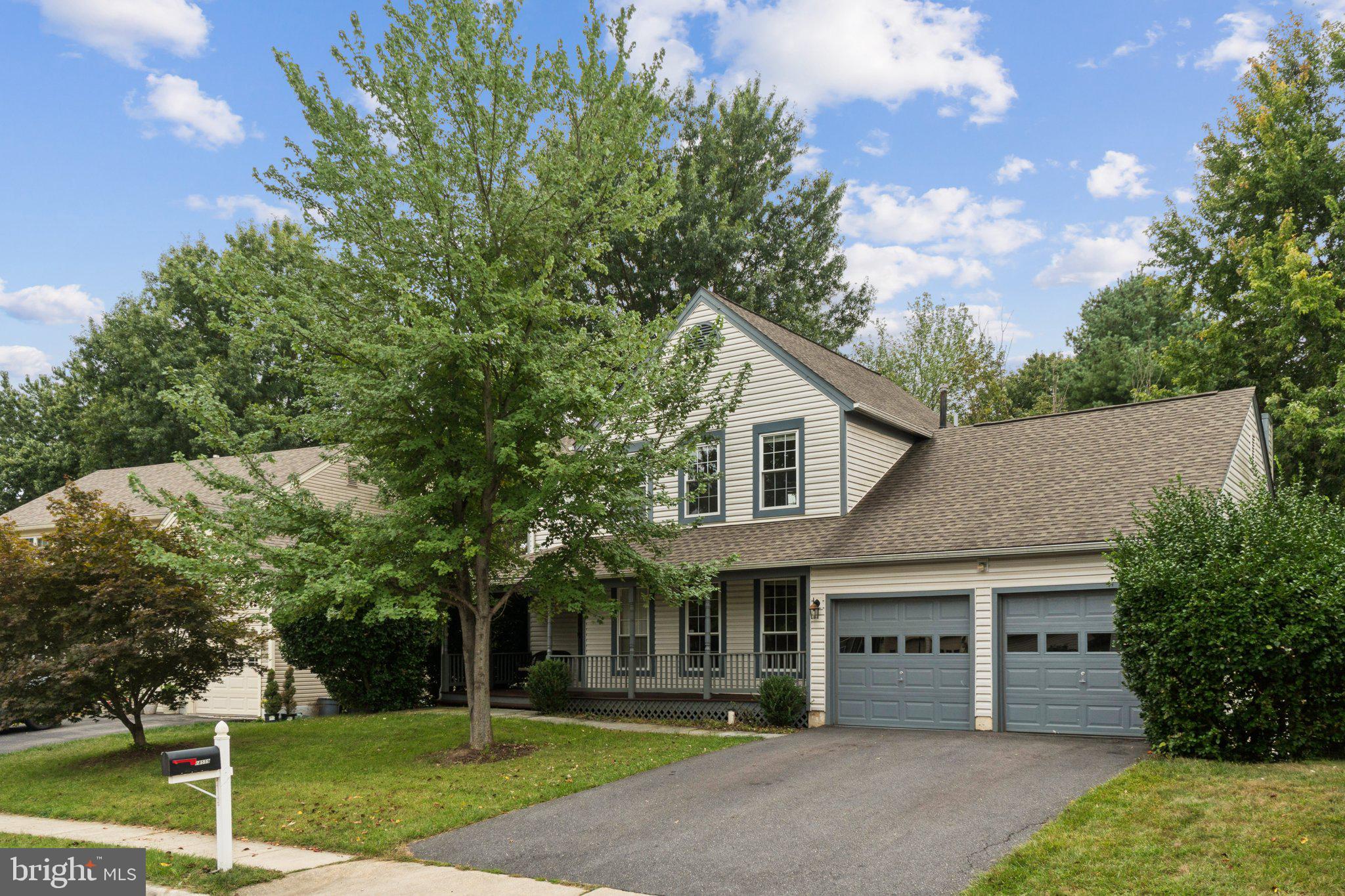 18559 Cape Jasmine Way Gaithersburg, MD 20879 - Photo 1 of 38 a front view of a house with a yard