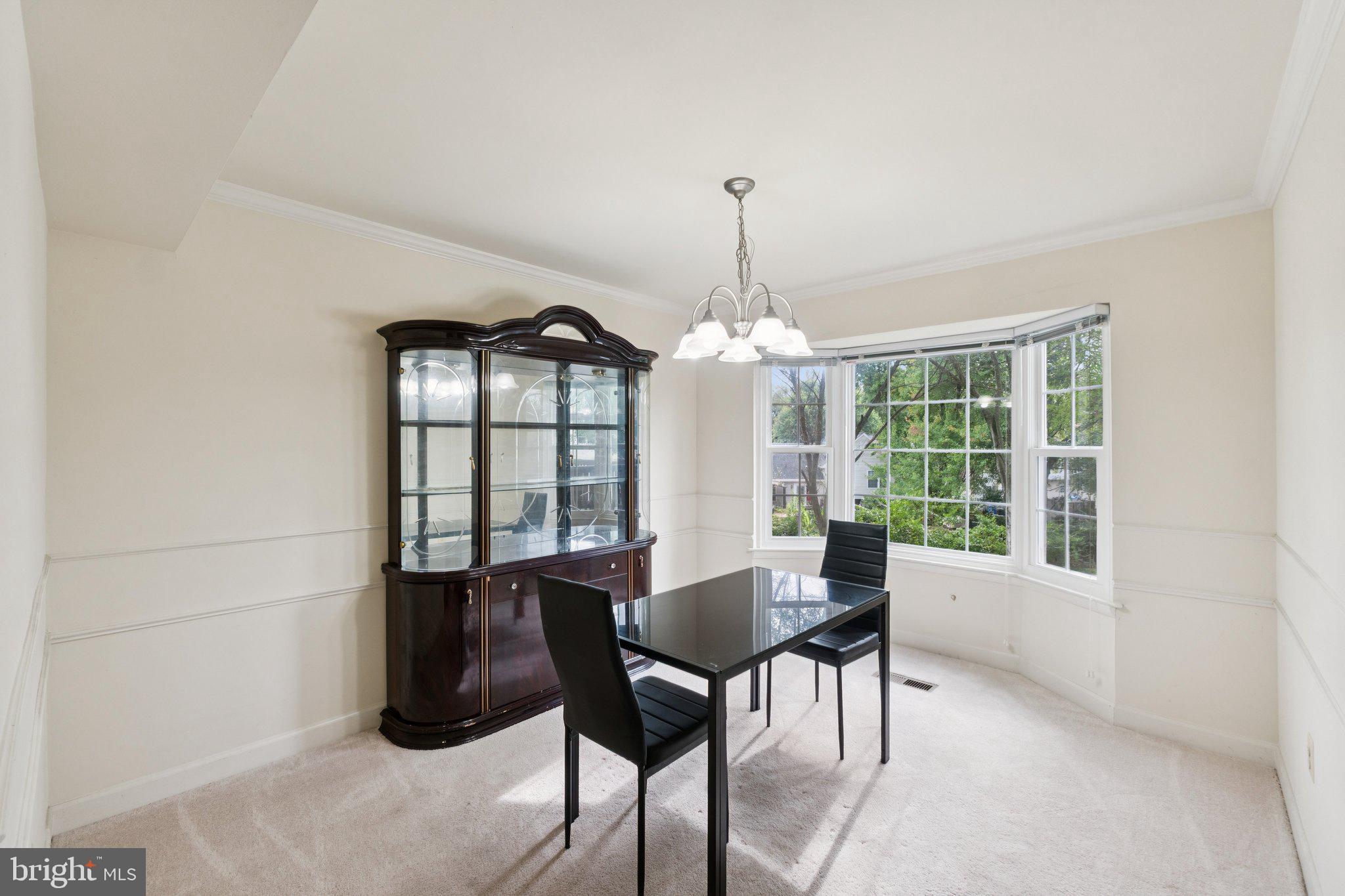 18559 Cape Jasmine Way Gaithersburg, MD 20879 - Photo 5 of 38 a view of a dining room with furniture window and outside view