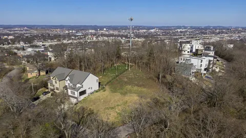 an aerial view of houses with yard