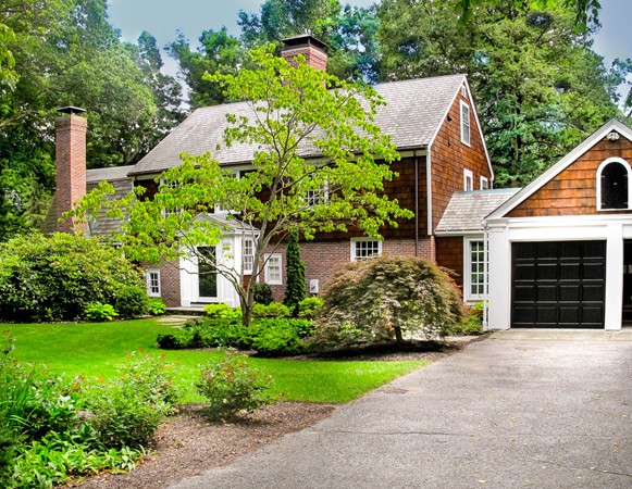 19 Lorena Road Winchester, MA 01890 - Photo 1 of 20 a front view of a house with a yard and potted plants