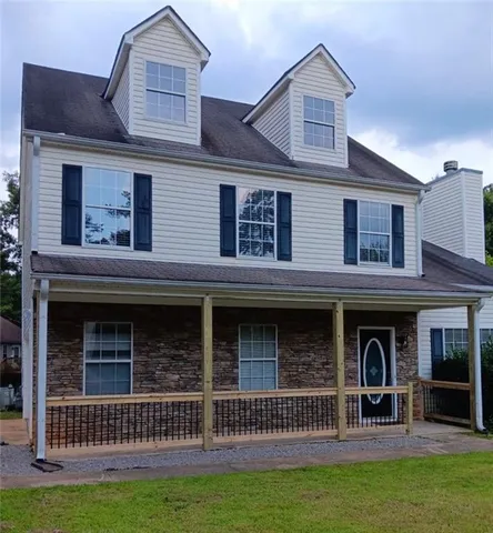 a front view of a house with yard