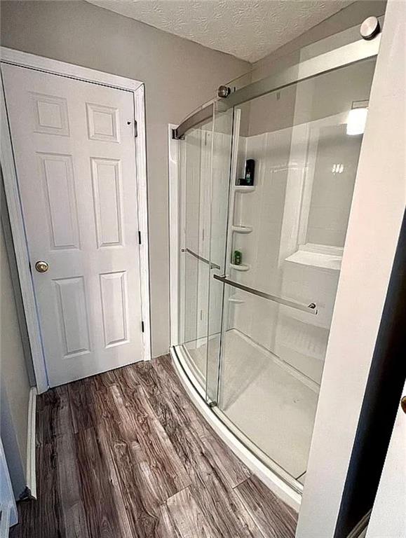 3267 Forrest Bluff Way Lithonia, GA 30038 - Photo 12 of 15 a bathroom with a glass shower door