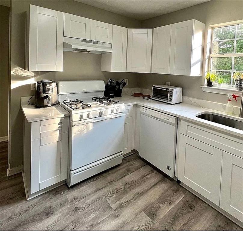 3267 Forrest Bluff Way Lithonia, GA 30038 - Photo 4 of 15 a kitchen with cabinets appliances a sink and a window