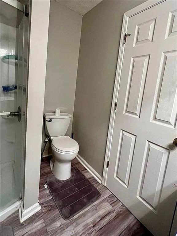 3267 Forrest Bluff Way Lithonia, GA 30038 - Photo 10 of 15 a bathroom with a toilet and a shower