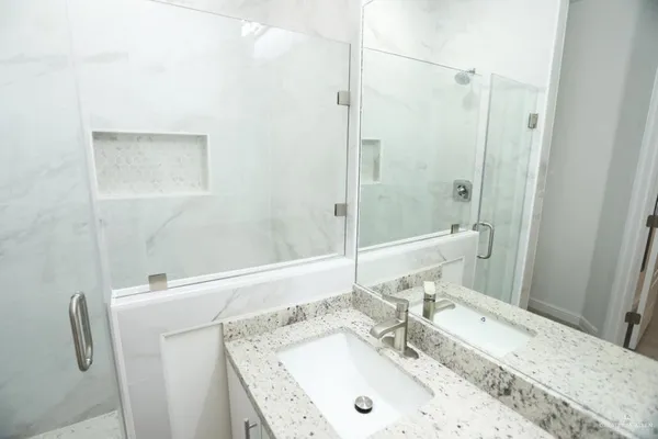 a bathroom with a sink and a mirror