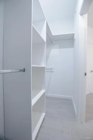 a view of an empty walk in closet