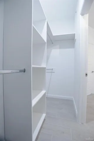 a view of an empty walk in closet