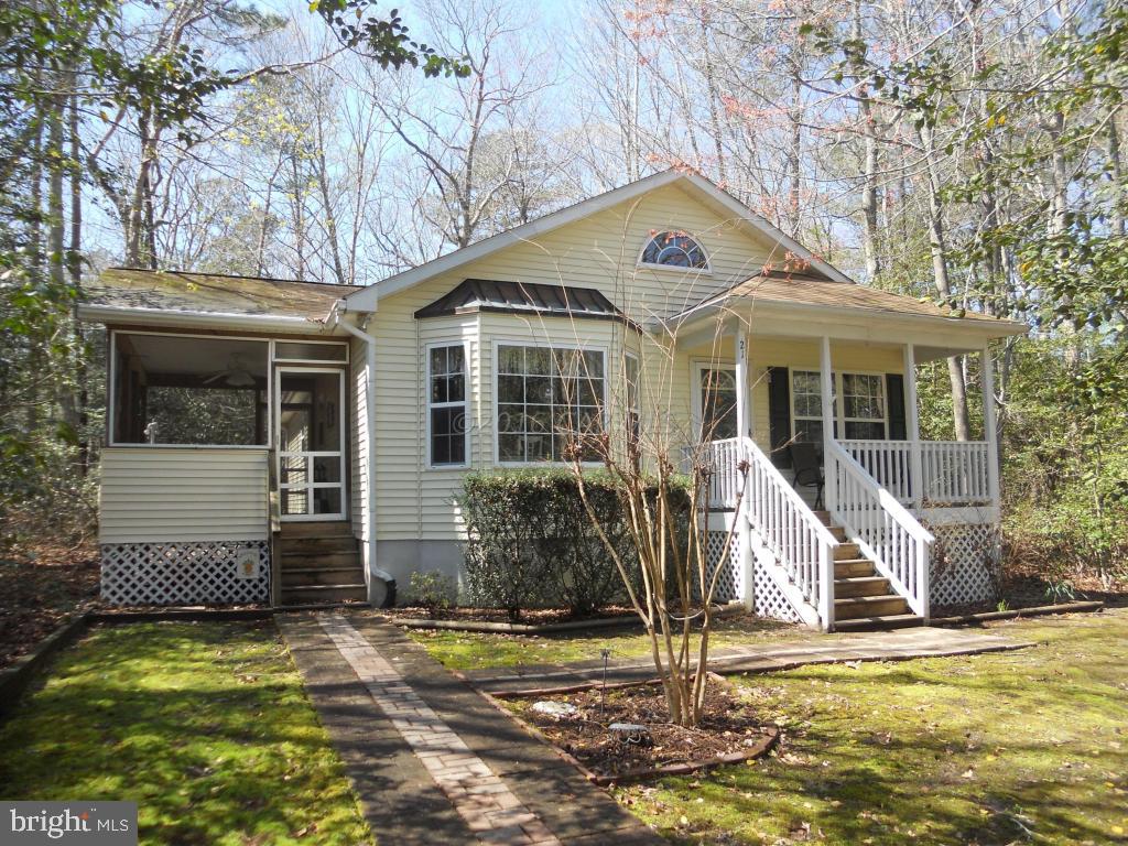 21 Rabbit Run Lane Ocean Pines, MD 21811 - Photo 1 of 22 a front view of a house with a yard