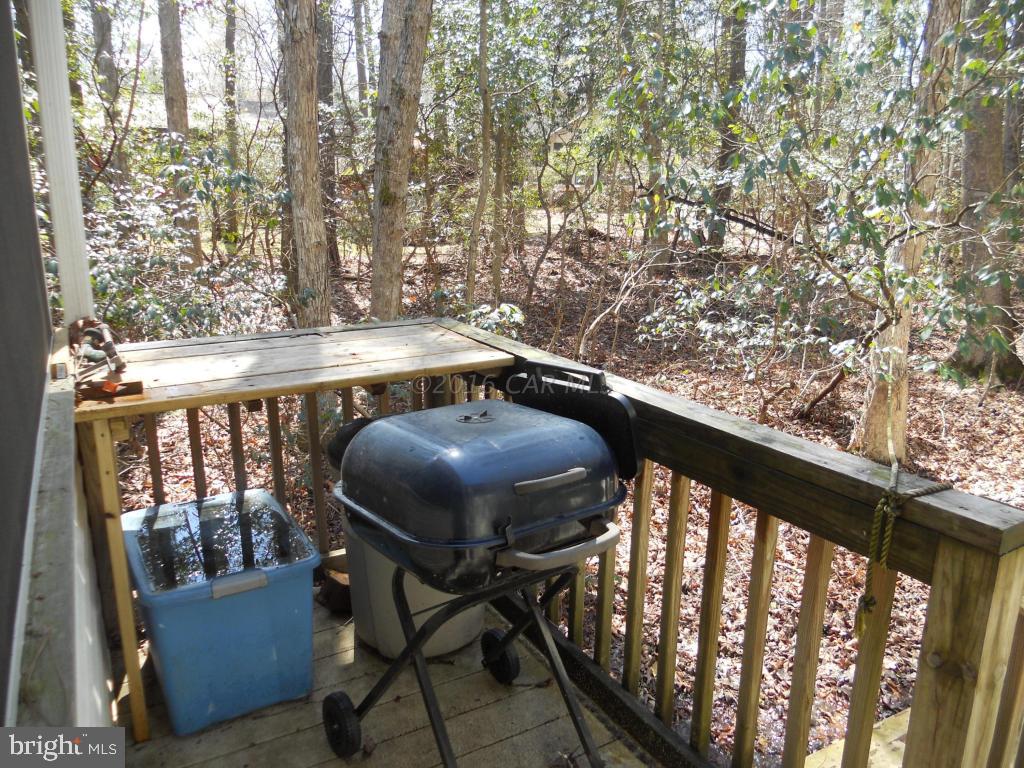 21 Rabbit Run Lane Ocean Pines, MD 21811 - Photo 13 of 22 a view of balcony with wooden floor and outdoor seating