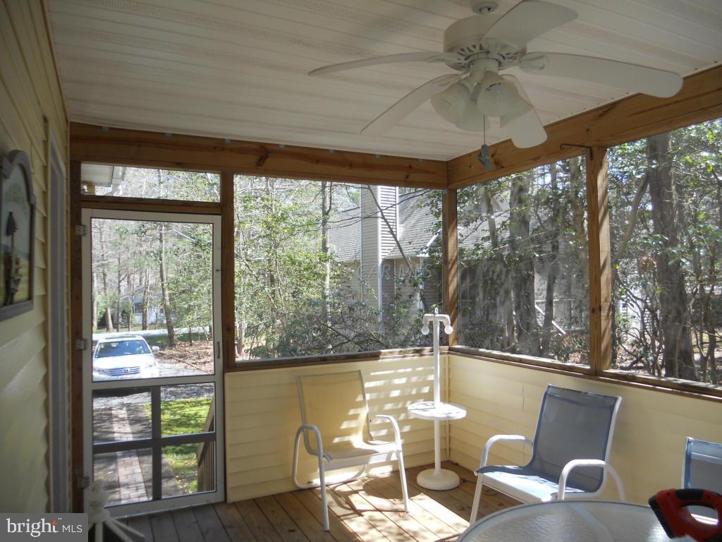 21 Rabbit Run Lane Ocean Pines, MD 21811 - Photo 15 of 22 a living room filled with furniture and a floor to ceiling window