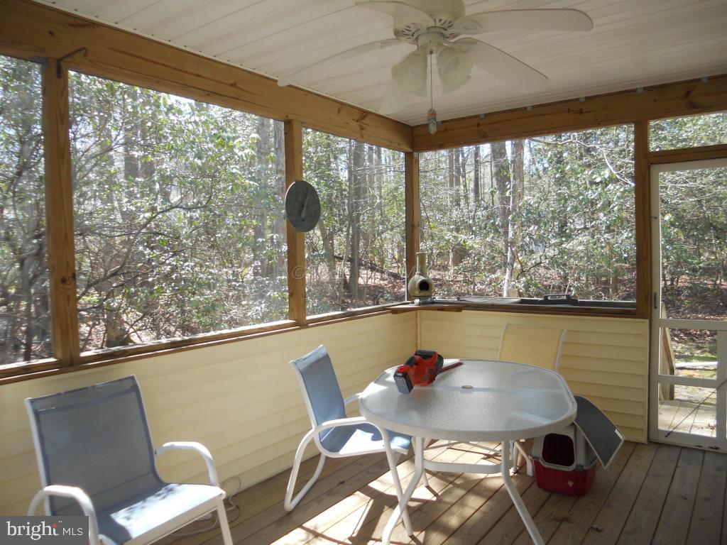 21 Rabbit Run Lane Ocean Pines, MD 21811 - Photo 16 of 22 a outdoor dining space with furniture and outdoor view