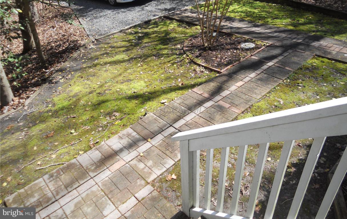 21 Rabbit Run Lane Ocean Pines, MD 21811 - Photo 17 of 22 a balcony view with large trees