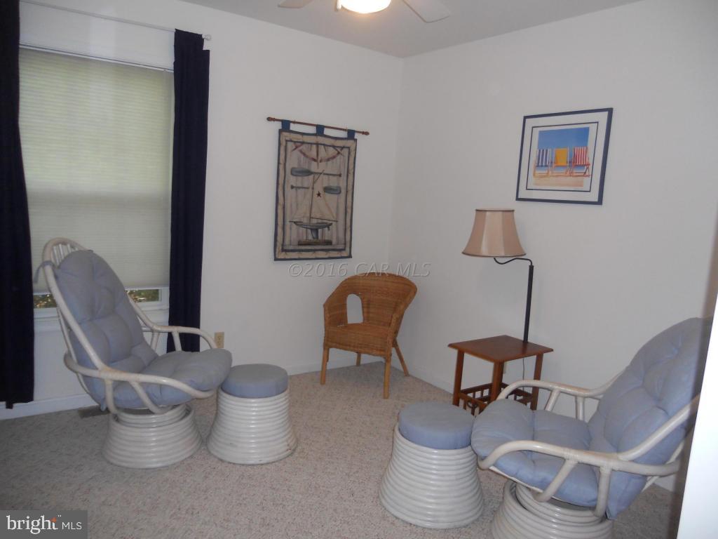 21 Rabbit Run Lane Ocean Pines, MD 21811 - Photo 19 of 22 a living room with furniture and a chair