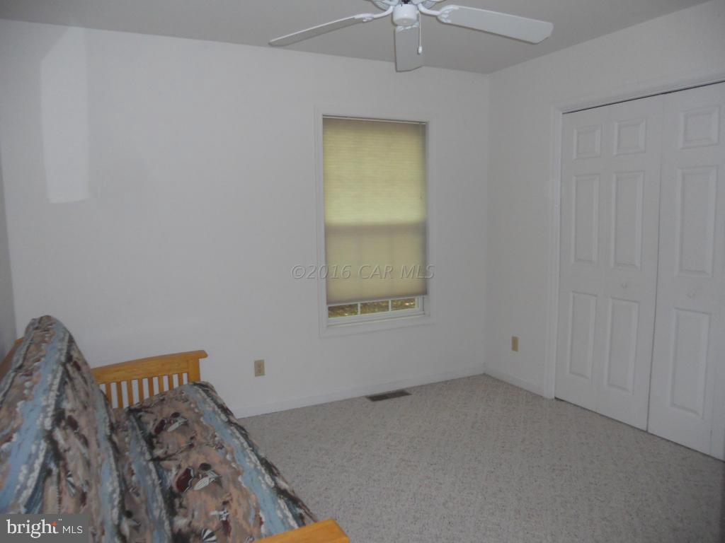 21 Rabbit Run Lane Ocean Pines, MD 21811 - Photo 20 of 22 an empty room with a bed and a window