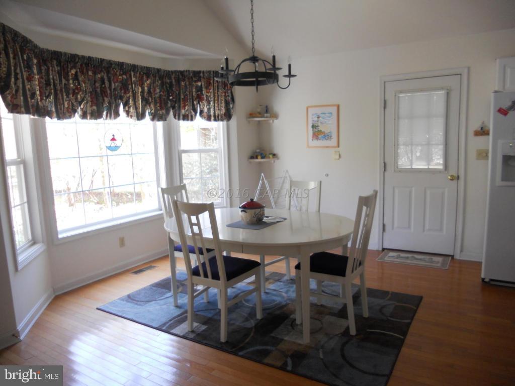 21 Rabbit Run Lane Ocean Pines, MD 21811 - Photo 5 of 22 a view of a dining room with furniture window and wooden floor