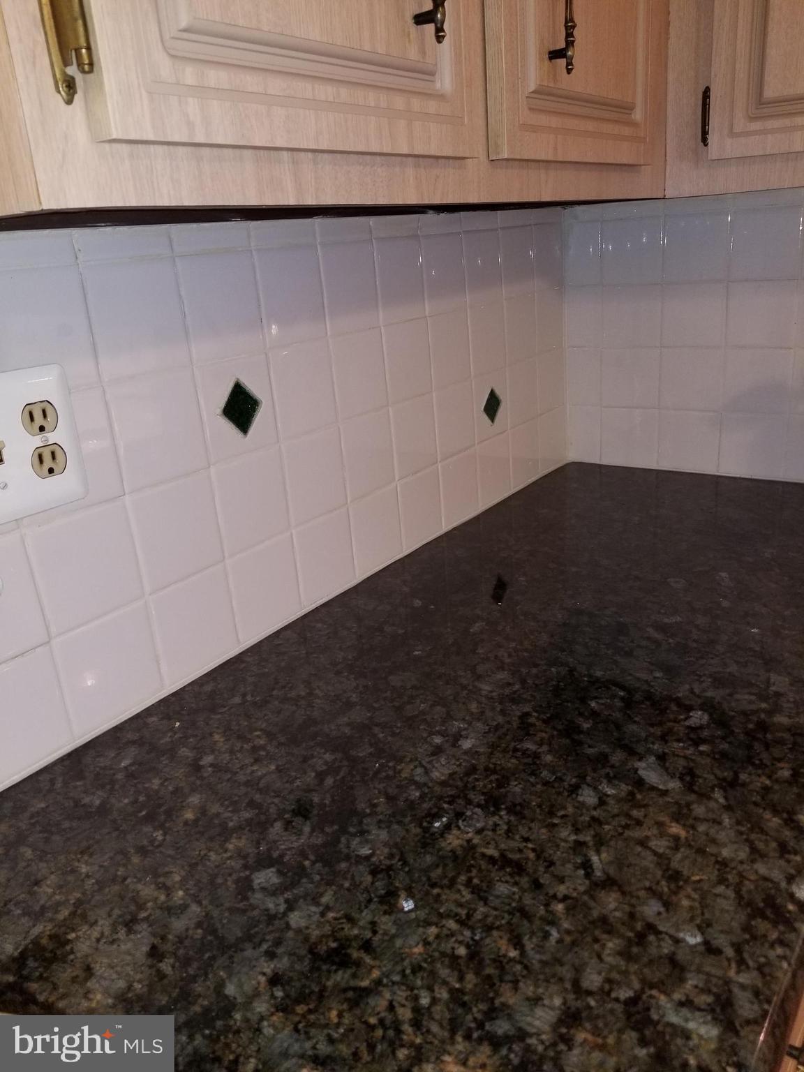 3216 Trinity Road Harrisburg, PA 17109 - Photo 8 of 26 Granite countertops w/ ceramic tile backsplash