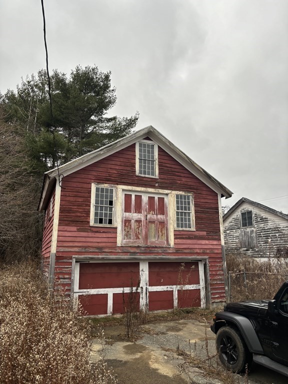 20 South Main Road Otis, MA 01253 - Photo 2 of 19 a front view of a house with a yard