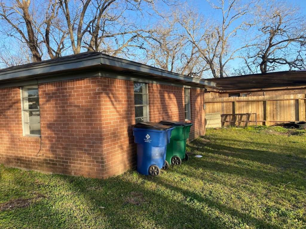 609 West 6th Street Sweeny, TX 77480 - Photo 11 of 12 a front view of a house with a yard