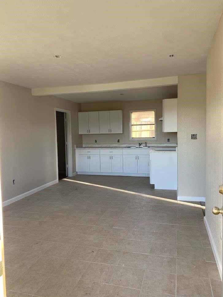 609 West 6th Street Sweeny, TX 77480 - Photo 2 of 12 a view of a kitchen with a sink and cabinets