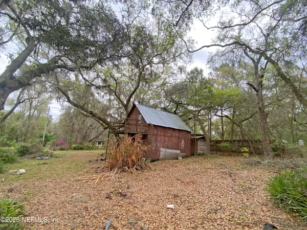 a view of a patio with table and chairs