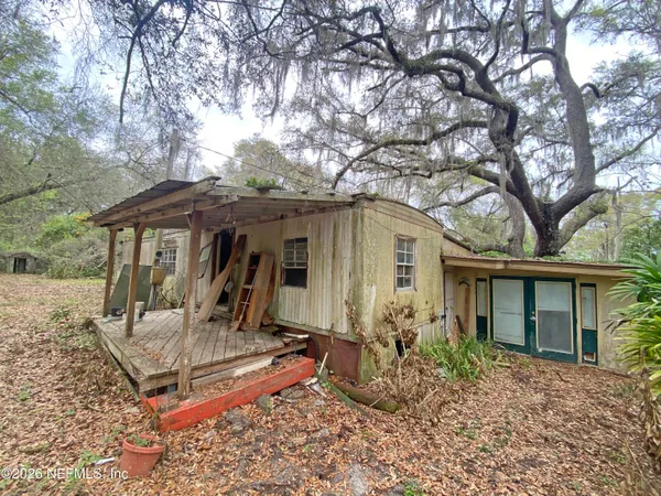 a room with furniture a window and gym equipment