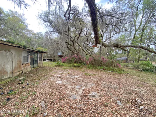 a backyard of a house with lots of green space