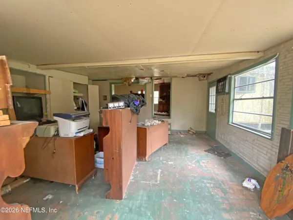 a backyard of a house with lots of trees