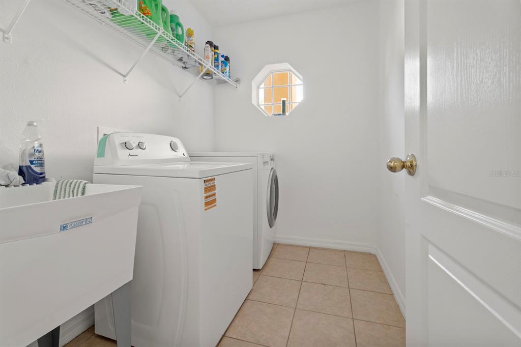5042 Rishley Run Way Mount Dora, FL 32757 - Photo 19 of 44 a utility room with dryer and washer
