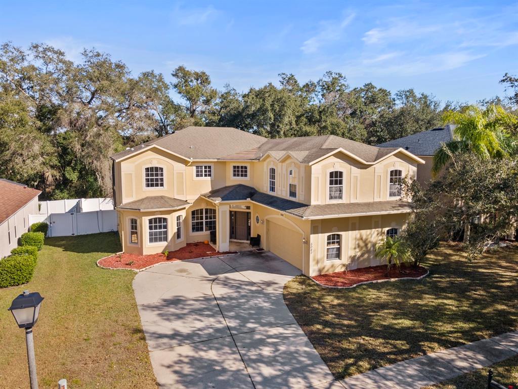 5042 Rishley Run Way Mount Dora, FL 32757 - Photo 2 of 44 an aerial view of a house with a yard