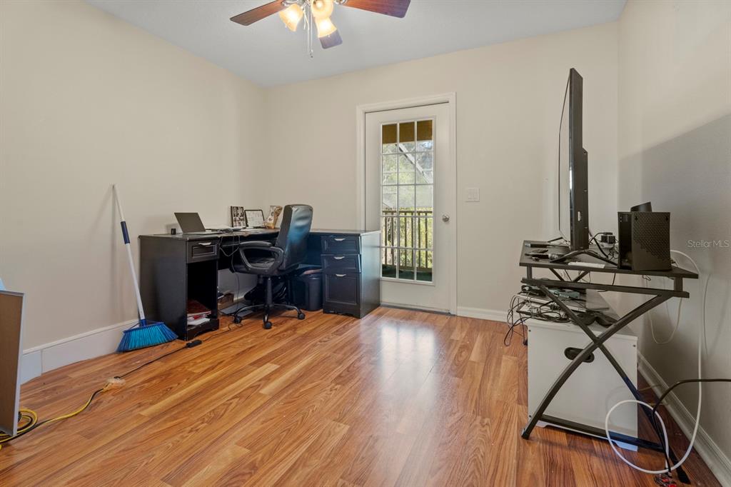 5042 Rishley Run Way Mount Dora, FL 32757 - Photo 23 of 44 a view of a workspace with furniture and a window