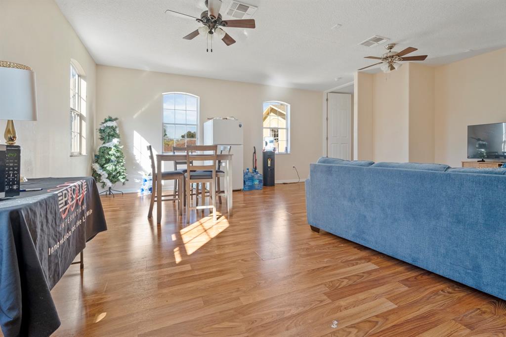 5042 Rishley Run Way Mount Dora, FL 32757 - Photo 34 of 44 a view of a living room and dining room