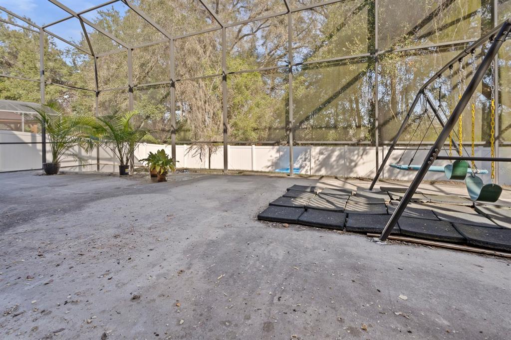 5042 Rishley Run Way Mount Dora, FL 32757 - Photo 37 of 44 a view of a backyard with a white house