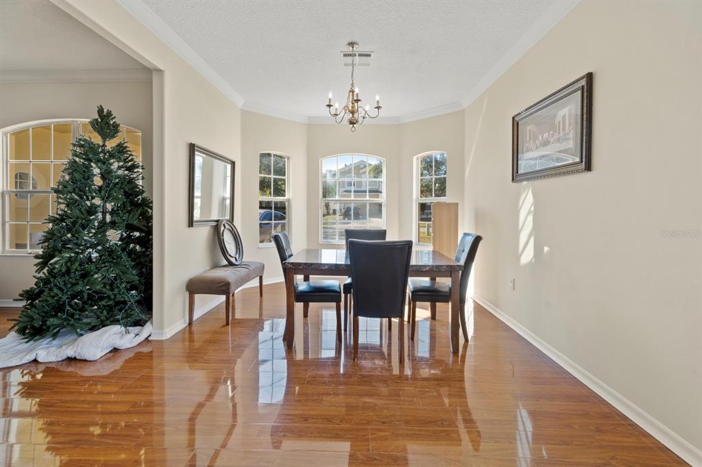5042 Rishley Run Way Mount Dora, FL 32757 - Photo 10 of 44 a view of a dining room with furniture and window