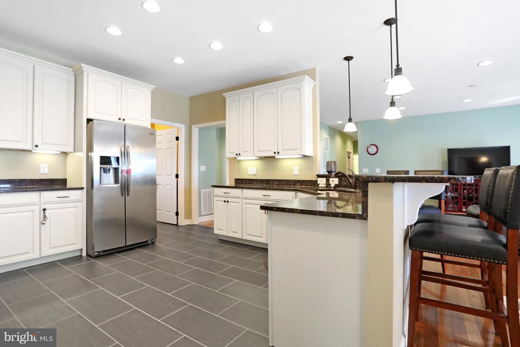 14213 Hicksville Road Clear Spring, MD 21722 - Photo 14 of 30 a kitchen with stainless steel appliances a refrigerator sink and stove
