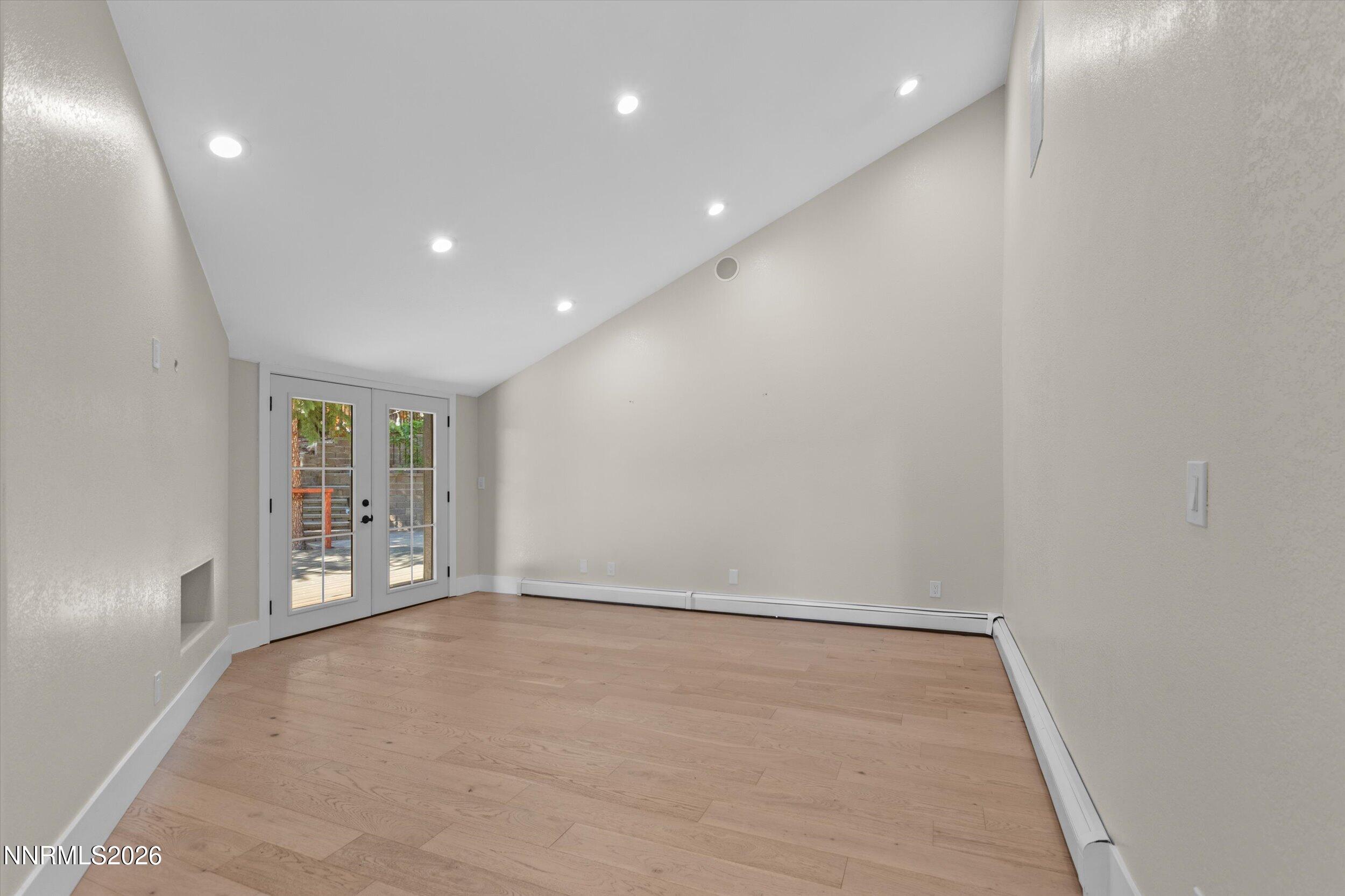 2725 West Lake Ridge Shores Reno, NV 89519 - Photo 16 of 49 an empty room with wooden floor and windows