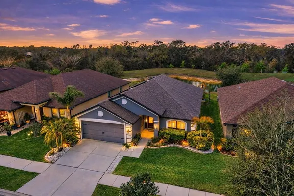 a aerial view of a house with a big yard