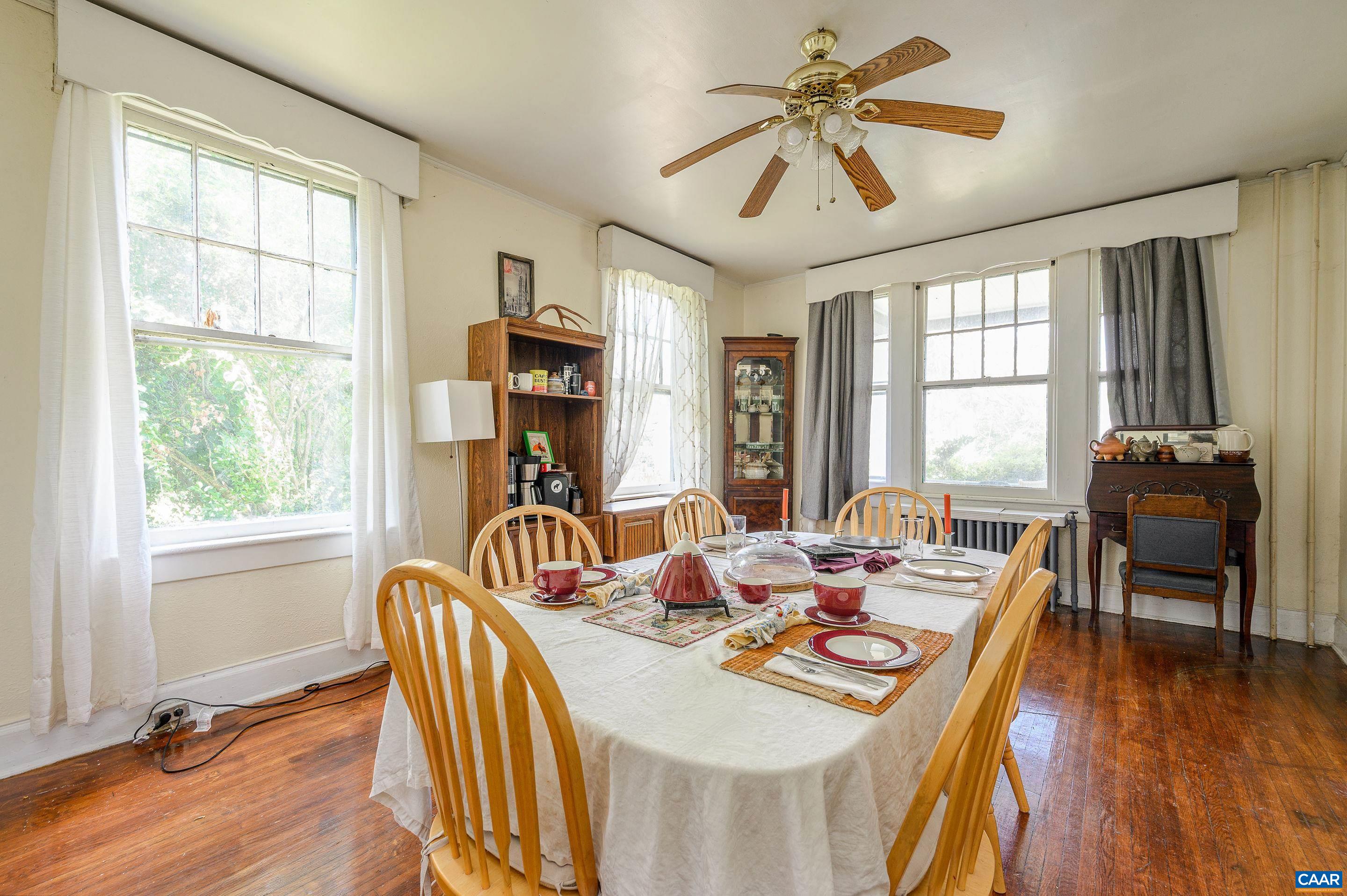 712 Ridge Street Charlottesville, VA 22902 - Photo 7 of 16 a view of a dining room with furniture window and wooden floor