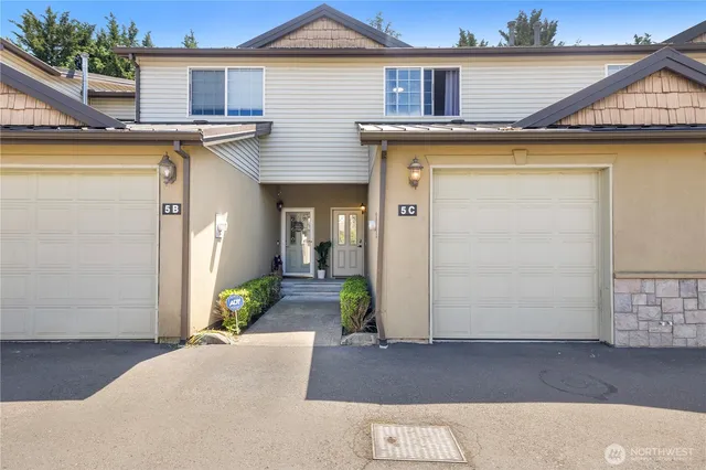 a view of a house with a wooden deck