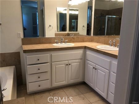 137 Tall Oak Irvine, CA 92603 - Photo 8 of 12 a bathroom with a sink and a mirror