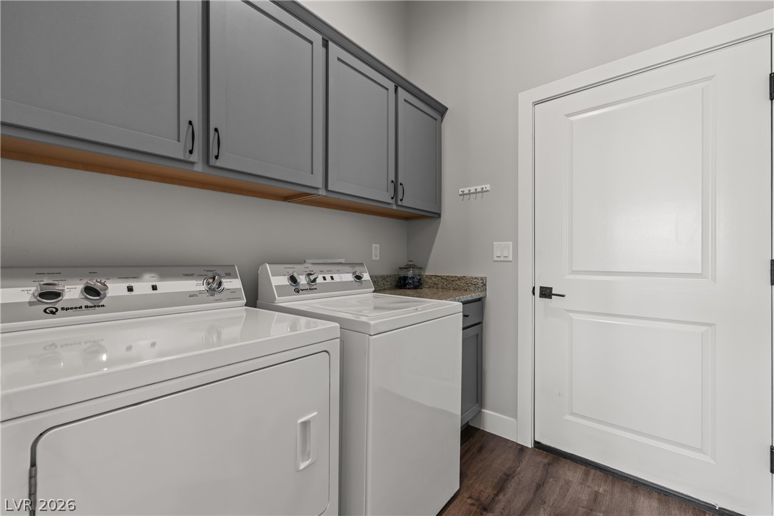 1436 Manassas Ridge Mesquite, NV 89027 - Photo 14 of 77 Functional laundry space featuring modern appliances and ample storage cabinetry.