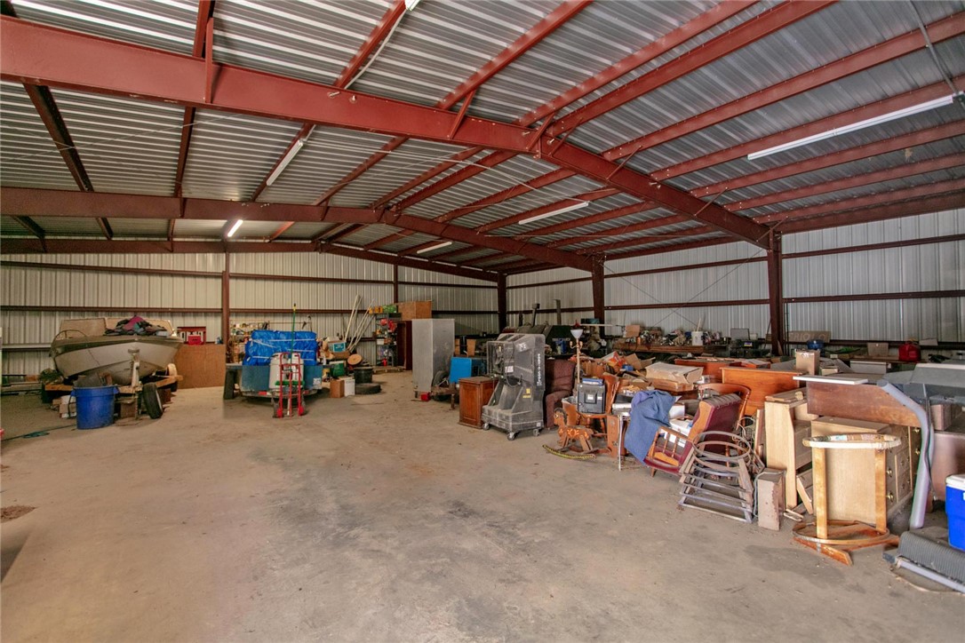 11041 Jackrabbit Lane Bryan, TX 77808 - Photo 12 of 47 a view of a garage with a bike and car