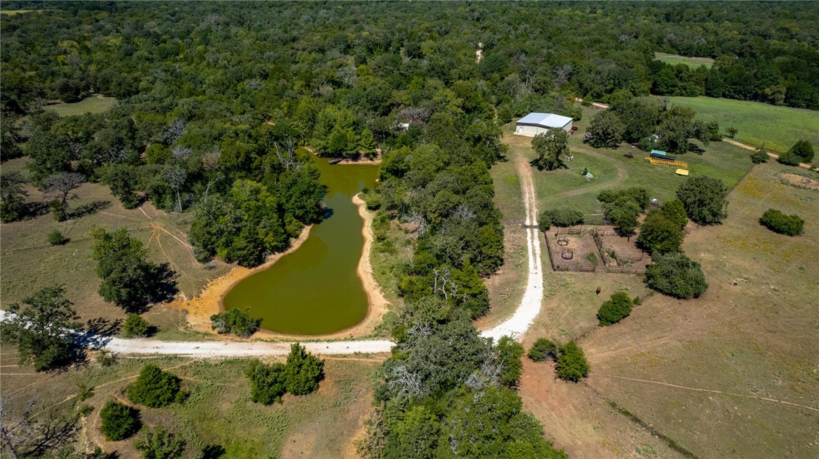 11041 Jackrabbit Lane Bryan, TX 77808 - Photo 45 of 47 an aerial view of a house with a yard and lake view