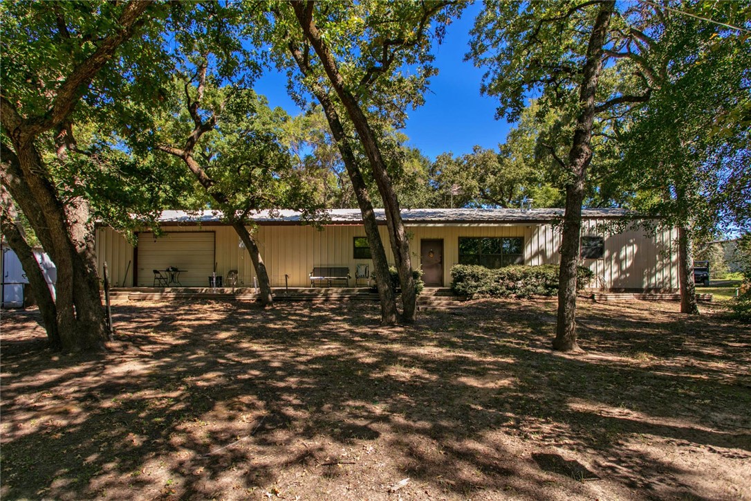 11041 Jackrabbit Lane Bryan, TX 77808 - Photo 8 of 47 a view of a house with backyard and trees