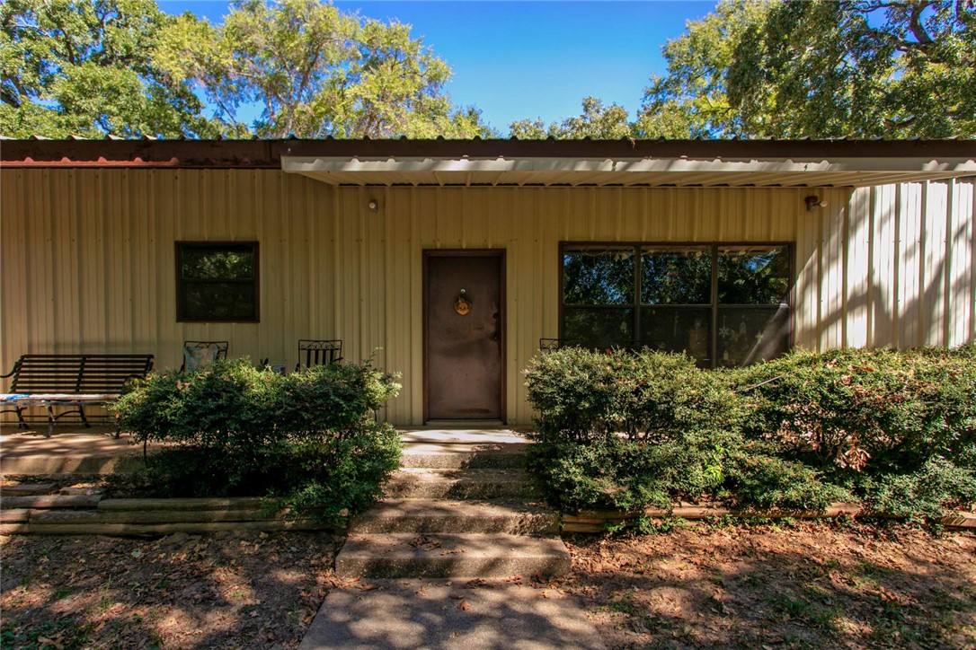 11041 Jackrabbit Lane Bryan, TX 77808 - Photo 9 of 47 a front view of house with a garden