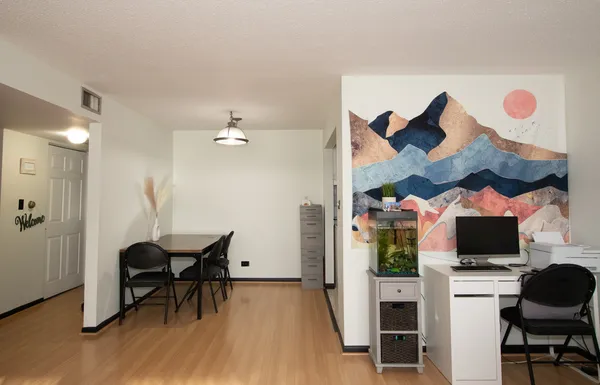 a view of a livingroom with furniture and a flat screen tv